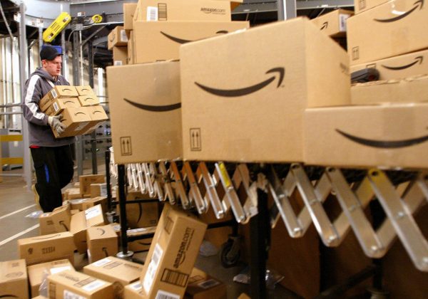 UNITED STATES - DECEMBER 13:  Daniel Brendoff sorts boxes before loading them onto trucks for shipping at Amazon.com's fulfillment Center in Fernley, Nevada on Tuesday, December 13, 2005. Between Thanksgiving and Christmas the Fernley Center will process approximately 2 million orders.  (Photo by Ken James/Bloomberg via Getty Images)